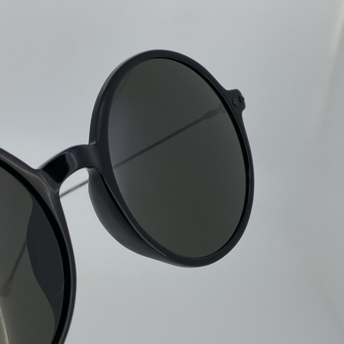 Ann Demeulemeester Sunglasses Round Shiny Black and Grey